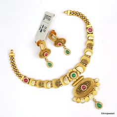 Vintage 22K Yellow Gold Choker Necklace with Earrings. Made of 22K Solid Gold and Set with Gemstones. Weight-34.390 Grams, Length-19 cm, Width-5.5 cm. Earrings-3.5 cm Gold Dual-tone Kundan Necklace For Celebration, Gold Dual-tone Kundan Necklace For Wedding, Gold Kundan Necklace With Meenakari For Anniversary, Traditional Gold Temple Necklace For Anniversary, Dual-tone Gold Jewelry For Anniversary, Gold Fusion Jewelry Sets With Hand Set Details, Fusion Style Gold Bridal Necklace Hand Set, Gold Fusion Bridal Necklace Hand Set, Heavy Gold Kundan Necklace For Anniversary