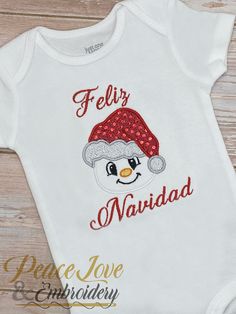 Feliz Navidad Muneco de Nieve Ninos, Merry Christmas Snowman Kids Bodysuit, Christmas Outfit, Custom Holiday Outfit, Snowman Christmas Hat PROCESSING TIME IS 3 DAYS FROM DATE OF PURCHASE. Processing time does not include shipping which is an additional 3-5 business days. If needed sooner a rush upgrade can be chosen during checkout, please message me first. The shirt is boutique quality and is very soft. These are embroidered designs, meaning it is stitched onto the shirt which makes it TOP QUAL White Holiday Onesie For Winter, White Winter Holiday Onesie, Merry Christmas Snowman, Unicorn Birthday Outfit, Unicorn Photos, Unicorn Outfit, Embroidered Designs, Baby Christmas Outfit, Baby Unicorn