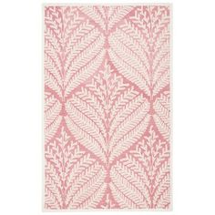 a pink and white rug with leaves on the front, in an intricate pattern that looks like