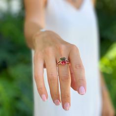 This watermelon tourmaline ring with a stylish split shank is exquisitely crafted in 925 sterling silver with 14K gold plating. Sparkling cubic zirconia is set into the shoulders of the ring band and accentuate the piece. Watermelon tourmaline is believed to have balancing powers that can help you magnify your strengths and release your insecurities. This ring will help you rediscover the meaning if you feel disconnected. Your Insecurities, Watermelon Tourmaline Ring, Rings Gemstone, Pink Tourmaline Ring, Healing Jewelry, Tourmaline Ring, Watermelon Tourmaline, Split Shank, Pink Ring