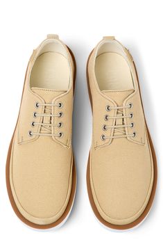 A lightweight, flexible outsole enhances the everyday appeal of a lace-up sneaker with a clean, classic profile. OrthoLite® Recycled™ footbed Textile and leather upper and lining/synthetic sole Imported Casual Lace-up Oxfords With Contrast Sole, Casual Lace-up Shoes For Derby With Textured Sole, Comfortable Beige Sneakers With Removable Insole, Brown Rubber Sole Sneakers For Summer, Beige Sneakers With Contrast Sole For Summer, Summer Beige Sneakers With Contrast Sole, Brown Summer Sneakers With Textured Sole, Summer Brown Sneakers With Textured Sole, Casual Slip-on Oxfords With Stitched Sole