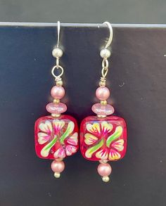 Floral Painted Art Glass Earrings With Swarovski Pearls, Czech Pressed Glass, and Sterling Silver - Etsy Adjustable Red Flower Beaded Earrings, Handmade Pink Glass Jewelry, Handmade Pink Czech Glass Jewelry, Beaded Czech Glass Flower Earrings Gift, Hand Painted Red Dangle Jewelry, Beaded Flower Earrings With Czech Glass For Gifts, Red Hand-painted Dangle Jewelry, Gift Beaded Flower Earrings With Czech Glass, Red Hand Painted Dangle Jewelry