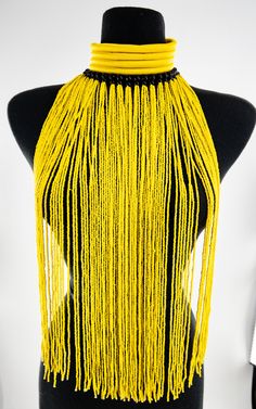 This combination of our kukua type choker and seed bead choker necklace is a glorious piece. A real statement piece fit for a queen. An original TrufacebyGrace design Measures: H- W Color : Yellow Handmade in Tanzania Yellow Beaded Choker For Festivals, Large Round Beads Choker, Yellow Choker Necklace For Festivals, Festival Choker With Large Beads, Yellow Round Beads Choker For Festivals, Beaded Choker Bib Necklace For Festivals, Yellow Choker With Round Beads For Festivals, Gold Beads Festival Choker Necklace, Yellow Beaded Choker Necklace For Festivals