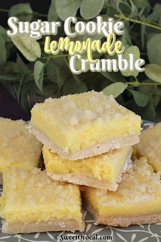 sugar cookie lemonade crumbles stacked on top of each other in front of green leaves