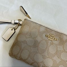 Coach Corner Zip Wristlet In Signature Canvas. Color Is Light Khaki/Chalk. Gold Hardware. Never Used. Nwt. Coach Beige Bag With Zipper Pouch, Chic Cream Coach Wristlet, Coach Gold Wristlet For Everyday Use, Chic Beige Wallet With Zipper Pouch, Elegant Beige Wallet With Zipper Pouch, Elegant Beige Wallets With Zipper Pouch, Gold Coach Wristlet For Everyday, Chic Beige Pouch Wristlet, Elegant Cream Clutch With Zipper Closure