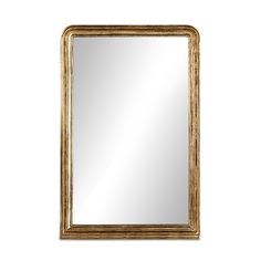 a gold framed mirror on a white wall