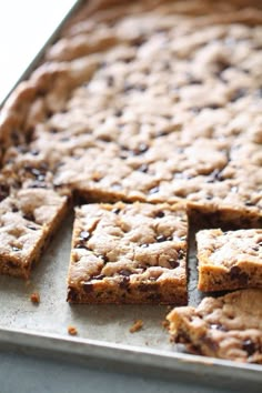 chocolate chip cookie bars cut into squares on a baking sheet