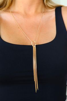 Long golf fringe tassel necklace. Adjustable Fringe Dangle Necklace, Chic Adjustable Tassel Necklace As A Gift, Chic Long Tassel Necklaces, Gold Tassel Necklace With Fringe For Gift, Chic Gold Tassel Necklace For Gifts, Adjustable Long Tassel Necklace, Fringe Long Necklace Gift, Long Fringe Necklaces For Gift, Fringe Long Necklace For Gift