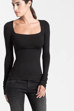 Back by popular demand, our Yvonne features a square neckline and long sleeves. A double layer of our silky European high-stretch jersey lines the chest area for additional support. Sexy and sophisticated at once, she's appropriate for any occasion.[SPLIT] The model, Sam, wearing size XS, is 5'8" (173 cm) tall. Total length approximately 25" (64 cm). European Jersey (96% Tencel, 4% Elastane). Machine wash or hand wash in cold water, and lay flat to dry. Do not tumble dry. Do not bleach. Iron on Jersey Knit Fabric, Square Necklines, Basic Tee, Powerful Women, Square Neckline, Double Layer, Knit Jersey, Peplum Top, Length Sleeve