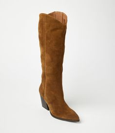 Crafted from soft suede, these pointed toe Western high boots are the perfect addition to any fall wardrobe. Pair them with jeans, skirts, or dresses for a versatile and stylish look that's perfect for the season's colors. With a sleek design and comfortable fit, these boots are a must-have. True to size Upper/Lining: Leather Heel height: 3" Platform: 0.25" Shaft Height: 17" Shaft Circumference: 14.5" Pointed toe shape Full zipper closure at inner ankle Imported Seychelles | Karen Kane Pointed T Brown Suede Knee-high Boots With Pointed Toe, Fall Suede Knee-high Boots With Pointed Toe, Suede Knee-high Boots With Pointed Toe For Fall, Chic Snip Toe Boots With Suede Lining, Fall Suede Heeled Boots With Wide Calf, Fall Wide Calf Suede Heeled Boots, Brown Suede Heeled Boots For Fall, Fitted Brown Suede Knee-high Boots, Fitted Knee-high Boots With Suede Lining For Fall