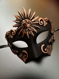 Greek Theater inspired masquerade mask based on ancient art designs. Regal Sun God Masquerade mask, perfect to wear to any theater mask events, costume events and masquerade ball parties. And can also be a display conversation piece for your home. The Mask base is painted in a smooth black shade and the embellishing pieces are painted in a brilliant Bronze using high quality paints. Other Color combinations also available. S H I P P I N G - Processed same day or within 24 hours. 1-2 day guarante Space Masquerade Mask, Masculine Masquerade Mask, Masquered Mask, Men’s Masquerade Mask, Fantasy Masquerade Mask, Masquerade Ball Outfit Ideas, Masquerade Mask Ideas, Masquerade Mask Aesthetic, Black And Gold Mask