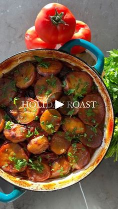 a pot filled with potatoes and tomatoes on top of a table next to some parsley