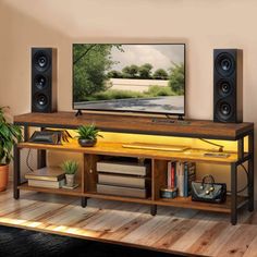 a flat screen tv sitting on top of a wooden shelf in a living room next to a potted plant