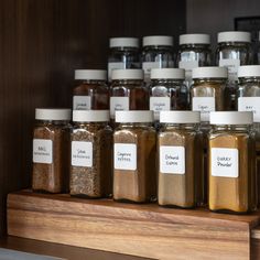 there are many different kinds of spices on the shelf