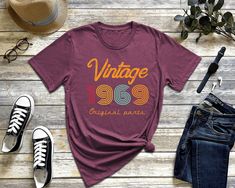 55th Birthday Shirt, 55 Years Old Shirt, Funny Birthday Shirt, Custom 1969 Shirt, 19649Graphic Shirt, 55th Birthday Gift, Vintage 1969 Atlascustomtees * All orders totaling $35 and up ship for free to US buyers.  brand for all of the colors and sizes. ** We use white vinyl for all colors but black vinyl for white, peach, heather athletic grey shirts. If you want black or gold vinyl please indicate on the personalization part.  Return policy: since it is print on demand type business we are unabl 1984 Shirt, Funny Birthday Shirt, 55th Birthday Gifts, 75th Birthday Gifts, Funny Birthday Shirts, 40th Birthday Shirts, 70th Birthday Gifts, Gold Vinyl, Old Shirts