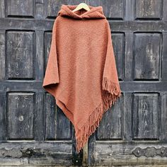 Wool blanket poncho  - cape  with fringes One size fits all  -  men or women.  Available with hood or without hood 100% wool CARE: Hand-wash and hang to dry, light iron if needed, or dry clean. MEASURES:  Available in two sizes: SHORTER Length at the front of the neckline to the bottom is ~87 cm/34 inches, the shoulder length is ~54cm/21 inches, LONGER Length at the front of the neckline to the bottom is ~115 cm/45 inches, the shoulder length is ~80cm/31 inches, Model in pictures is 170cm high a Winter Fringe Cape Outerwear, Cozy Winter Poncho With Fringe, Oversized Fringe Cape For Winter, Winter Fringe Cape Shawl, Winter Shawl Cape With Fringe, Winter Fringe Cape Poncho, Fringe Cape Poncho For Winter, Hooded Wool Poncho For Fall, Poncho With Hood