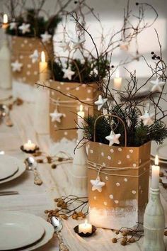 christmas table setting with candles and small bags