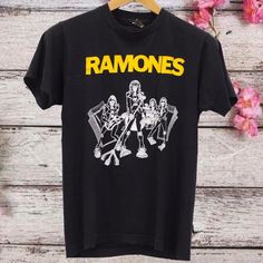 Vintage Ramones Tee Punk Rock, Ramones Black T - Shirt, Black Music T - Shirt, Vintage T - Shirt, Gifts for best friends, Tee, Tour T-Shirt WELCOME TO OUR STORE  LOOMINGDUO  --------- PRODUCT ---------- - Cotton graphic T-shirt, custom t shirts, custom t shirt printing - Lightweight, extremely comfortable and durable 100% Cotton - High Quality - Size: S, M, L, XL, 2XL, 3XL, 4XL, 5XL We have a size chart in the picture, please refer to and choose the right product. ------SHIPPING-------- Every or Rock Style T-shirt With Band Logo For Music Festivals, Summer Rock T-shirt With Band Logo, Grunge T-shirt With Front Print For Music Festivals, Black Band Merch T-shirt With Logo, Rock Style Band Logo T-shirt With Crew Neck, Unisex Band Merch T-shirt For Concerts, Edgy Band Logo T-shirt For Summer, Black Band Logo T-shirt For Concert, Band Merch T-shirt For Concert