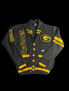 For a limited time, the Signature Brand is offering the GSU Varsity Pre-order Apparel: Cardigan uniquely designed with embroidered patches. Sizes are available in Small-4X. Pre-ordered apparel can take 25 days to manufacture and additional days to be receive in our inventory. There are no refunds on pre-ordered items (group/customized orders); please visit our website for additional FAQs: https://www.signaturebrandhtx.com/faq Again, thanks for your support. We can't wait to see you in our branded apparel!! Collegiate Cotton Long Sleeve Cardigan, Collegiate Long Sleeve Cotton Cardigan, Collegiate Long Sleeve Cardigan For College, Long Sleeve Collegiate Cardigan For College, Collegiate Cardigan For College In Fall, Collegiate Fall Cardigan For College, Collegiate Style Cardigan For Fall College Season, Fall Collegiate Style College Cardigan, Collegiate Style Fall Cardigan For College