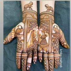 two hands with hendi designs on them