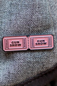 2 tickets to the Gun Show Pin. Sizing Approximately 1.5 x 1 inches ( 3.8 x 2.5 cm). Soft Enamel, standard rubber backing. Fast + Trackable shipping. Makes a great gift for any Dad Joker, or fan of Puns. Awesome Design Featuring our 2 tickets Pin Pin. #FanfitGaming #EnamelPin #TicketsToTheGunShow #GamerGift Twitch Logo, Soft Enamel, Gamer Gifts, Enamel Pin, Puns, Cool Designs, Enamel Pins, Great Gifts, Gaming