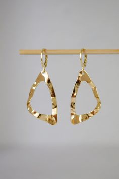 ✦ Triangle earrings. ✦ Materials used:- ✧ Triangular gold plated brass pendants. * Size: about 33mm long, 18.5mm wide, 1mm thick. ✧ Huggies hoop earrings Material and size:- Real 24k gold plated 304 stainless steel lever back hoop earrings measures 14.5 x 12 mm  Other jewelry options are also available please visit our shop for more details. https://www.etsy.com/de/shop/Anvira10 ✦ Packing: Carefully packaged and ready to give as a gift. If you want to add a note, please leave me a message with y Gold Nickel-free Hoop Earrings For Party, Nickel-free Gold-plated Hoop Earrings For Party, Gold-tone Metal Hoop Earrings As Gift, Triangle Shaped Single Earring As A Gift, Triangle Single Earring As Gift, Gold-tone Pierced Hoop Earrings For Gift, Gift Gold-tone Pierced Hoop Earrings, Hammered Gold Plated Earrings, Nickel-free Gold Triangle Jewelry