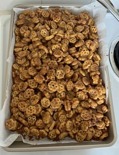 a pan filled with cereal sitting on top of a stove