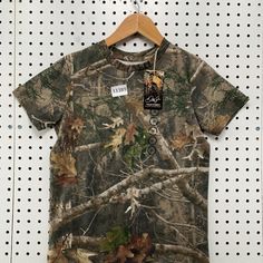 New Redhead Camo Hunting Shirt Youth Medium Brown Camouflage NWT  15x20 Check Out My Other Listings What will you benefit from purchasing from Dreams In Motion? Fast shipping & handling time:  95% of our order will be shipped in the same or next business day in order to ensure our customers receive their orders as quickly as possible (Except weekends & US holidays).  Safe and secure packaging:  All packages will be packed very carefully and securely.  Tracking number available (US Only):  Tracking service is available for all US orders at no additional cost.  FREE Insurance (US Only):  All US domestic shipment will be automatically insured at no additional cost.   Notice The condition for pre-owned items may include small spots, runs, mends, alterations, or other wear associated with pre-o Hunting Mom Shirt, Camouflage All Over Print Cotton Tops, Camouflage All-over Print Cotton Tops, Outdoor Camouflage Cotton T-shirt, Fall Camouflage T-shirt With Crew Neck, Fall Camouflage Crew Neck T-shirt, Camouflage Graphic Print Tops For Outdoor, Camouflage Cotton Crew Neck Shirt, Outdoor Camouflage Cotton Shirt