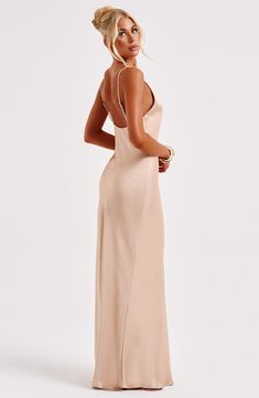 Made in our super luxe. bias cut hammered satin with a gorgeous sheen. the Anja maxi skims the body for a beautiful fit. The perfect dress to create memories in. it features a plunge V-shaped neck and delicate straps.   Colour: Champagne. Luxury bias cut satin. Delicate straps. Skims over the figure. Plunge neckline. Maxi length. Model is an XS and is wearing an XS. Homecoming Dresses Corset, Midi Dress Wedding Guest, Long Sleeve Homecoming Dresses, Dresses Flowy, Maxi Dress Sale, Create Memories, Sparkle Dress, Plunge Neckline, Dresses By Length