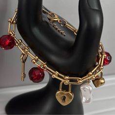 This super gorgeous gold charm bracelet is made pearls, red crystal beads stainless steel gold heart, key and heart charm pendants linked to a beautiful stainless steel ball chain.  Perfect as a gift for your loved ones or yourself. The charm pendants is set along th stainless steel ball chunky chain. It's 18 carat gold plated tarnish resistant nickel free.   This bracelet is a classic statement elegant piece that draws all attention to the crystal red beads and charm as it sparkles.  This beautiful piece can be worn both dressed or casual. Make a statement with this classy piece. Can be paired with our other bracelets.  Also available in silver. see link https://tarocollection.etsy.com/listing/1672251493 The quantity is limited. Grab yours now! Handmade with love ❤️ Cheap Handmade Red Charm Bracelet, Chain Charm Bracelet, Valentines Bracelets, Beads Charm, Bracelet Pearl, Heart Key, Red Beads, Gold Charm Bracelet, Wrist Cuffs