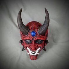 Red Goblin Oni style Noh mask Based off traditional Japanese Noh Masks. Made of PLA and hand painted in acrylics. This mask is large enough to be wearable by most people. Comes as mask only without straps. Inside dimensions are: 240 H x 160 W mm/ 9.5 H x 6.25 W in Overall Dimension: 340 H x 200 W mm/ 13.5 H x 8 W in Each piece is individually made to order so keep in mind: It will possibly take a couple weeks to paint and get it shipped out. The paint and coloring may differ slightly the picture Artistic Red Masks And Prosthetics For Costume, Traditional Red Masks And Prosthetics For Costume, Traditional Red Costume Masks And Prosthetics, Artistic Red Mask For Costume, Traditional Cosplay Masks And Prosthetics, Traditional Cosplay Masks, Red Full Face Cosplay Masks And Prosthetics, Traditional Halloween Masks And Prosthetics, Red Full Face Mask For Cosplay