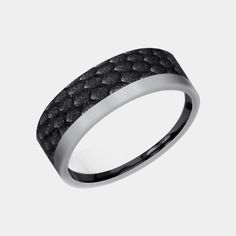 Introducing the Talon, a striking embodiment of power and myth brought to life in the form of a men's wedding band. This 7mm comfort fit ring masterfully combines the muted elegance of grey tantalum with the sleek, enduring presence of black titanium. What sets the Talon apart is its captivating dragon scale pattern, a design that invokes the mystique and majesty of mythical beasts. This pattern, rich in detail and symbolism, is complemented by one satin edge, adding a refined contrast to the ri Black Diamond Wedding Rings, Mythical Beasts, Wedding Ring Diamond Band, Scale Pattern, Mythical Beast, Dragon Scale, Black Diamond Ring, Mens Wedding Bands, Modern Man