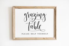 a framed sign that says, organizing table please help yourself on the wall above it