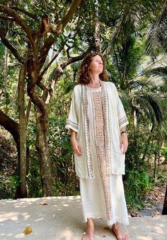 This boho cape, coverup made from thick cotton and has nice abstract prints. Has no belt. Good to wear for special occasions as well as daily. Has nice off white color. Wash in cold water, with gentle cycle is recommended. Length 90 cm. Bohemian Beige Kaftan For Beach Cover-up, White Open Front Kimono For Festival, White Boho Print Kimono For Beach Cover-up, Beige Bohemian Long Kimono, Beige Long Bohemian Kimono, Bohemian Beige Kaftan For Festival, Bohemian White Sets For Spring, White Bohemian Sets For Spring, Bohemian Beige Kimono For Beach Cover-up