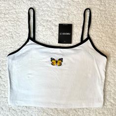 -New Without Tags Crop Top From Forever 21 -Small Butterfly Graphic -Contrast Detailing On Neckline And Straps Trendy White Tank Top For Summer, Forever 21 White Summer Crop Top, Forever 21 White Tank Top For Spring, Forever 21 White Spring Tank Top, Forever 21 White Crop Tank Top, White Crop Top Tank From Forever 21, Forever 21 White Summer Tank Top, Trendy White Forever 21 Crop Top, Casual White Forever 21 Tank Top