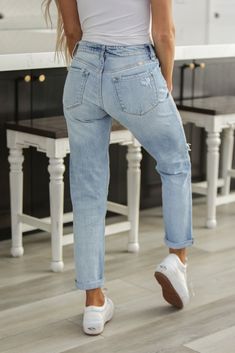 Our Mid Rise Boyfriend Jean comes in light-washed denim with distress and fading detail. Sits right at the natural waistline with a relaxed fit for a lived-in feel. This boyfriend jean can be worn folded at the hem for a more casual look, or unfolded for a more sophisticated look perfect for a night out. Comes with a classic 5-pocket design, single-button front, and zip-fly closure Model is 5’3” wearing a size 1/24 Inseam of a 1/24 is 26" 99% Cotton, 1% Spandex Boyfriend Pants Jeans, Simple Mom Outfits, Light Blue Jeans Outfit, Early Fall Fashion, Mid Rise Boyfriend Jeans, Gorgeous Images, Boyfriend Outfit, Blue Jean Outfits, Boyfriend Denim