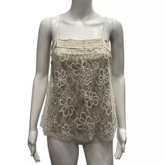 Chanel Gold Ivory Camisole Lace Tank Top Chanel Gold Ivory Camisole Tank Top Gold Stretch Lining (60% Silk, 34% Lurex, 6% Spandex) Body: 57% Rayon, 43% Nylon Made In Italy From The 2003a Fall Collection By Karl Lagerfeld Floral Lace Ivory White Size Us 8, Marked 40 15.5" Bust, Flat 15-16" Height 15.25" Waist, Flat 17" Hips, Flat 7.75"-9" Strap Drop Cc Logo On Lining Braided Strap Accent Sleeveless Square Neckline Small Mark On Lace, Pictured. Pre-Owned. Excellent Condition. Light Normal Wear, In Designer Beige Tops For Spring, Designer Cream Tops For Spring, Luxury Beige Summer Tops, Braided Strap, Tank Top Camisole, Fall Collection, Lace Tank Top, Cc Logo, Cream And Gold