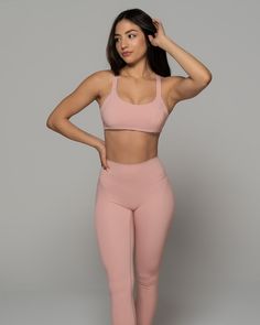 Stay supported while you sweat with this Stardust Pink Sports Bra. Featuring a solid color design, scoop neckline and strappy back - it's so stylish. Made from high-quality nylon-spandex material, it is soft and comfy. Plus, integrated quick-dry technology keeps you cool and dry. Wear with matching bottoms and fresh kicks for a simple but chic look. We are obsessed! Activewear With Built-in Bra And T-back, Athleisure T-back Sports Bra With Seamless Construction, Nylon Activewear With Built-in Bra And Strappy Back, Stretch Nylon T-back Activewear, High Stretch Activewear With Built-in Bra And Scoop Neck, Solid Sports Bra With Built-in Padding And 4-way Stretch, High Stretch Scoop Neck Sports Bra With Built-in Bra, Seamless T-back Activewear For Workout, Seamless Stretch T-back Activewear