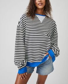 Free People Classic Striped Crew Style No. 82463712 So cool and classic, this timeless crewneck is featured in an oversized, slouchy silhouette and staple striped print with contrasting hems for added dimension. Fit: Relaxed, oversized fitFeatures: Crew neckline, dropped shoulders, contrast hemsWhy We <3 It: Lovely for layering or styling solo, this so tried and true piece is the perfect effortless essential your wardrobe has been wanting. Fit Note: This style may run large. For a truer fit, we Stripe Sweatshirt, Casual Pullover Sweater, Brown Sweatshirt, Oversize Pullover, Pull Oversize, Casual Long Sleeve Shirts, Striped Sweatshirts, Loose Pullover, Oversized Pullover