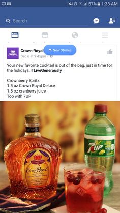 a bottle of crown royal next to a glass with ice and raspberries on it