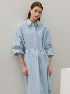 This long shirt dress from Atelier Nain features a wide placket and a half-open design, offering comfort without the gap between buttons.- With a belt to accentuate the waistline- Oversized fit for comfortable wear experience- The uneven hemline to add a unique point of interest* Model shots may differ from the actual product color due to shooting location, time, and graphic techniques. Refer to the product cut images for the actual color. Spring Shirt Dress With Tie Waist And Relaxed Fit, Spring Relaxed Fit Shirt Dress With Tie Waist, Spring Button-up Belted Dress For Daywear, Relaxed Fit Belted Shirt Dress For Spring, Spring Relaxed Fit Belted Shirt Dress, Knee-length Shirt Dress With Belted Cuffs For Daywear, Spring Midi Shirt Dress With Roll-up Sleeves, Relaxed Fit Shirt Dress With Roll-up Sleeves For Daywear, Relaxed Fit Shirt Dress With Tie Waist For Daywear