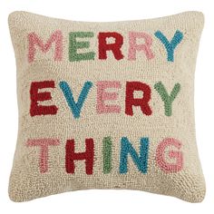 a decorative pillow that says merry everything on the front and back, with multicolored letters