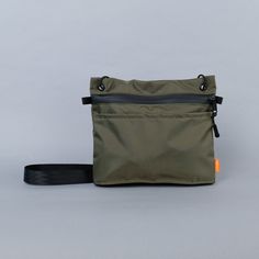 A minimalist’s dream bag. The Wayland Sacoche sits tight to the body but holds a lot for its size. Two reach-in pockets on either side will hold small items for quick-release. An inside sleeve (with a 70/30 split) will keep your pens and your phone separate from the rest, and safe from the click-click-click noise of a Functional Shoulder Bag With Zipper Pocket For On-the-go, Functional Green Shoulder Bag With Pockets, Everyday Carry Shoulder Bag With Pockets, Shoulder Bag With Pockets For Everyday Carry, Everyday Carry Pouch Shoulder Bag With Zipper Pocket, Functional Everyday Pouch With Pockets, Practical Travel Pouch With Pockets, Pouch Shoulder Bag With Zipper Pocket For Everyday, Nylon Everyday Carry Standard Backpack