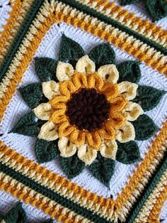 a crocheted square with a sunflower on it