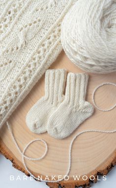 Pair of white baby socks with ribbed cuffs, suitable for newborns and infants. Baby Socks Knitting Pattern, Better Breakfast, Stone Soup, Modern Deco, Skirts For Kids, Sock Knitting Patterns, Toddler Age, Lace Shawl, Oh Baby