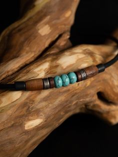 Turquoise, with its fascinating coloring, awakens a longing for distant shores and reminds us of wonderful vacation days by the sea. It is also called the protective stone of travelers; it stands for loyalty, friendship and solidarity. It is also said to strengthen the ability to protect oneself. Our Tiken necklace is presented here in an interplay of three turquoise gemstone beads with polished rosewood beads and antique stainless steel beads. The incomparable stone with its unique coloring is Southwestern Turquoise Jewelry For Beach, Adjustable Spiritual Turquoise Necklace For Beach, Bohemian Adjustable Necklaces For Outdoor, Bohemian Adjustable Necklace For Outdoor, Rustic Turquoise Jewelry For The Beach, Artisan Adjustable Turquoise Necklace For Beach, Spiritual Adjustable Turquoise Necklace Gift, Handmade Spiritual Necklaces For Outdoor, Adjustable Bohemian Jewelry For Outdoors