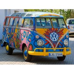 a colorful vw bus parked on the street