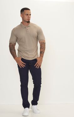 The Fine Ribbed Polo Shirt offers a perfect blend of casual comfort and refined style. Crafted from a soft and breathable fabric with a fine ribbed texture, this shirt provides a luxurious feel against the skin while allowing for optimal airflow to keep you cool and comfortable. Its classic polo collar adds a touch of sophistication, making it suitable for a variety of occasions, from casual outings to more formal events. The ribbed design adds subtle visual interest and texture to the shirt, enhancing its overall appeal. With a tailored fit that flatters the silhouette, this polo shirt offers a polished look without sacrificing comfort. Available in a range of versatile colors, the Fine Ribbed Polo Shirt can easily be dressed up or down to suit your personal style. Pair it with chinos or Ribbed Cotton Polo Collar Top, Collared Ribbed Top For Business Casual, Ribbed Collared Top For Business Casual, Casual Tops With Ribbed Collar For Business Casual, Casual Tops With Ribbed Collar For Business, Beige Casual Tops With Ribbed Collar, Ribbed Collared Top With Relaxed Fit, Beige Relaxed Fit Top For Business Casual, Classic Ribbed Tops For Business Casual