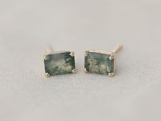 Moss agate is captivating, reminiscent of forest floors and seaweed on the waves. A perfect gift for nature lovers. - 7x5 emerald cut faceted moss agate stones - stud earrings with push backings or screw backings - available in sterling silver or solid 14k yellow, white or rose gold - made to order, ships within 1-2 weeks of purchase Let's keep in touch! Instagram, @thebealine facebook.com/thebealine Please see my policies page for more information regarding jewelry care, shipping, exchanges, et Moss Agate Jewelry, Minimalist Studs, Agate Earrings, Agate Jewelry, Earrings Green, Stone Studs, Green Agate, Green Earrings, Gifts For Nature Lovers