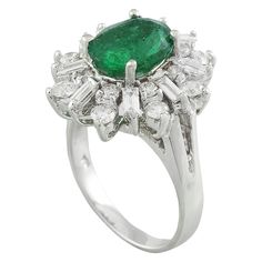 Stamped: 14K Total Ring Weight: 8 Grams Emerald Weight 2.85 Carat (10.00x8.00 Millimeters)Diamond Weight: 1.20 carat (F-G Color, VS2-SI1 Clarity )Face Measures: 19.25x17.45 Millimeter SKU: [600621] Classic Platinum Gemstones Gia Certified, Classic Gia Certified Platinum Gemstones, Gia Certified Platinum Classic Gemstones, Classic Formal Emerald Gemstones, Classic Oval Platinum Gemstones, Formal Pear-shaped Emerald Ring In White Gold, Dazzling Oval Emerald Ring For Formal Occasions, Formal Gia Certified Cluster Ring, Classic Cluster Diamond Ring Gia Certified